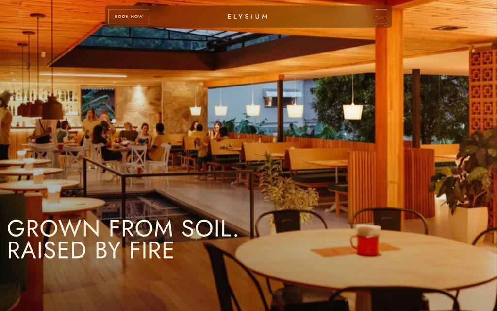 Field and Flame restaurant site: cream ground with harvest photography, clay and field-green accents, headed 'Grown from soil, raised by fire'.
